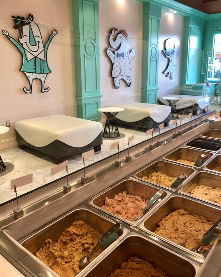 A glass display case with many different types of food