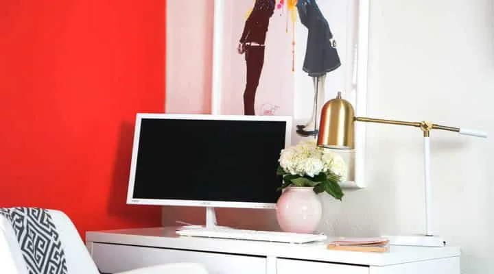 A living area with a sink and a mirror